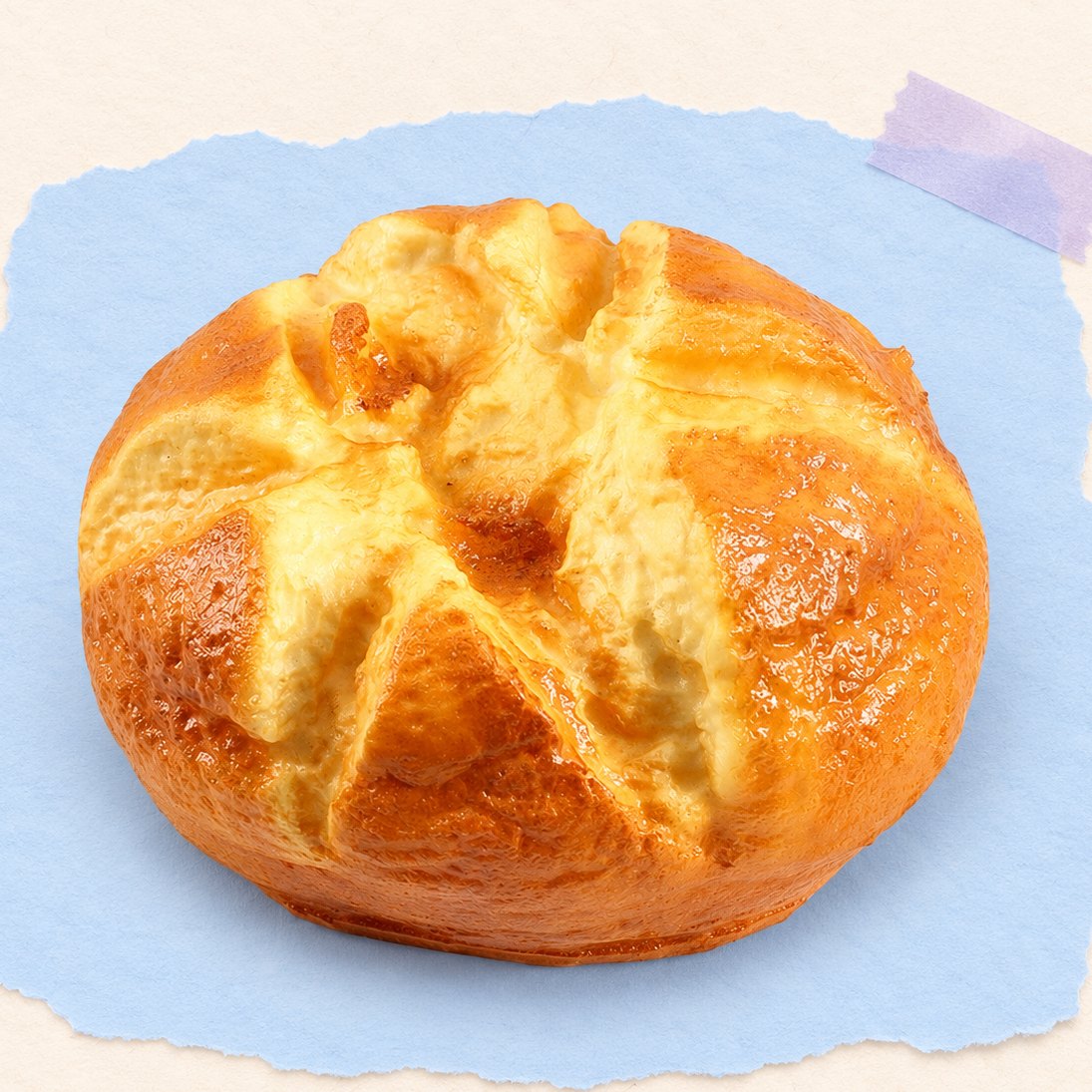 Squishy pão redondo de 14,5 cm com cruz, sobre papel cor pastel