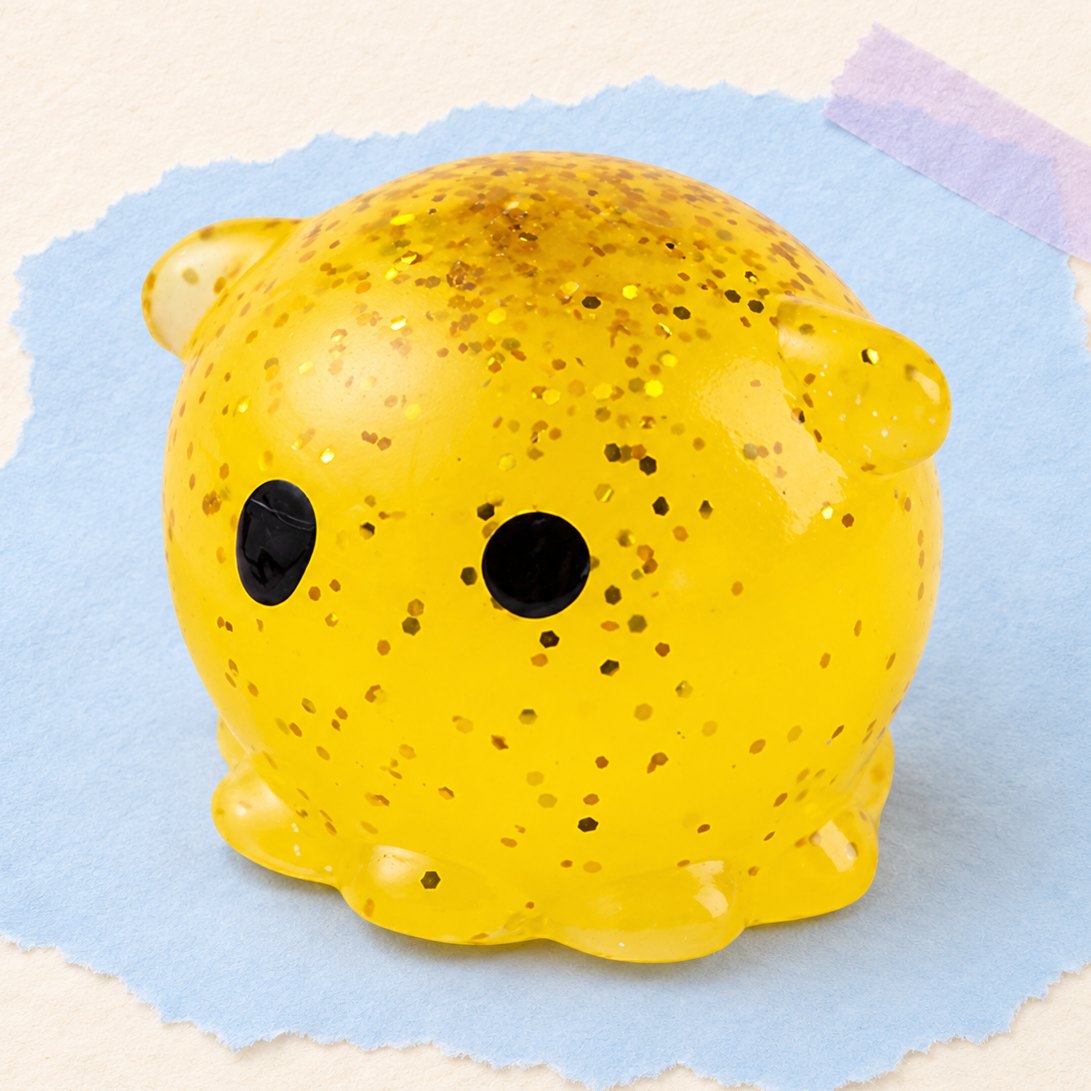 Squishy polpo con glitter, foto del prodotto su carta pastello