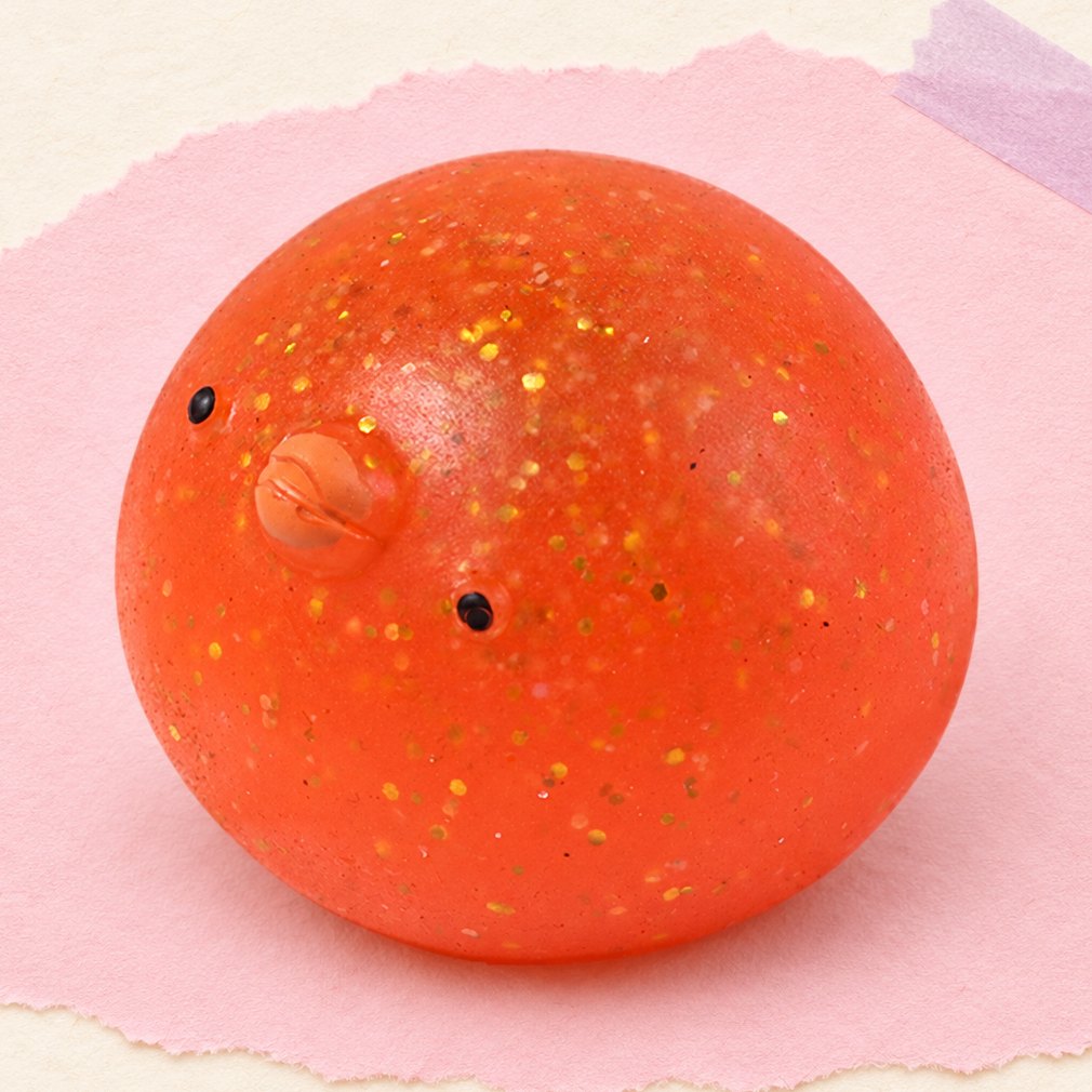 Squishy pulcino con glitter, foto del prodotto su carta pastello