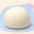 Steamed bun squishy dumpling – Steamed Bun Squishy, Slow Rising PU, 9 cm (White), product photo on pastel paper