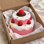 Strawberry cake squishy, unboxed from a parcel with tissue paper