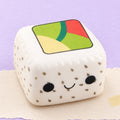 Sushi squishy slow rising – Kawaii Sushi Squishy, Slow Rising (White Rice, Black Sesame), product photo on pastel paper