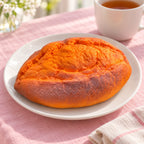 Baked Sweet Potato Squishy, Slow Rising PU, on a plate on a breakfast table