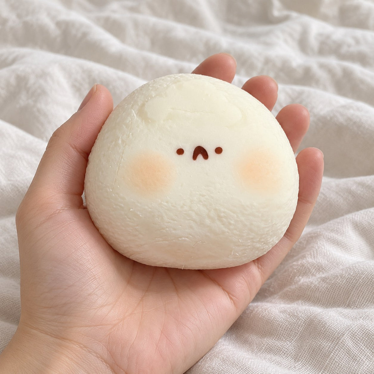 Taba Squishy Hamster Daifuku, Extra Soft (white), held toward the camera, first-person view