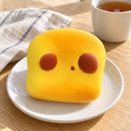 Toast squishy kawaii slow rising (Dog toast), on a plate on a breakfast table