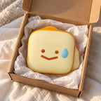 Toast squishy kawaii (Smiley toast), unboxed from a parcel with tissue paper