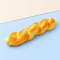 Twisted bread squishy – Twisted Bread Squishy, 20 cm Stick, product photo on pastel paper