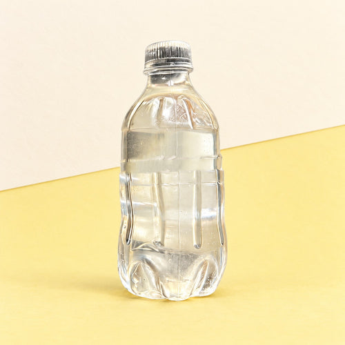 Water bottle squishy clear maltose jelly, product photo on pastel paper