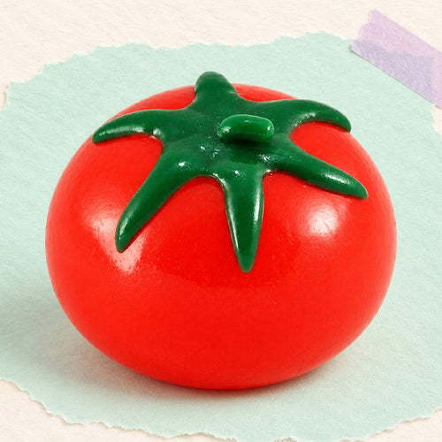 Squishy de agua con forma de fruta tomate – Squishy de agua con forma de fruta, tomate, uva o limón, foto del producto sobre papel pastel