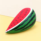 Watermelon squishy slow rising – Watermelon Squishy, Slow Rising PU, product photo on pastel paper