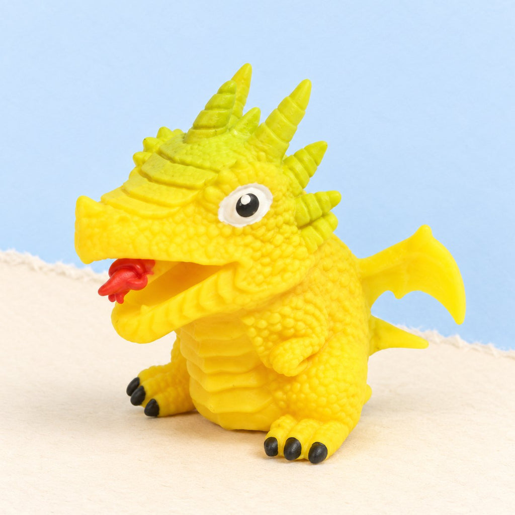 Wende-Dino-Ei Squishy zum Umstülpen, gelb, Dino-Motiv zufällig, auf Pastellpapier