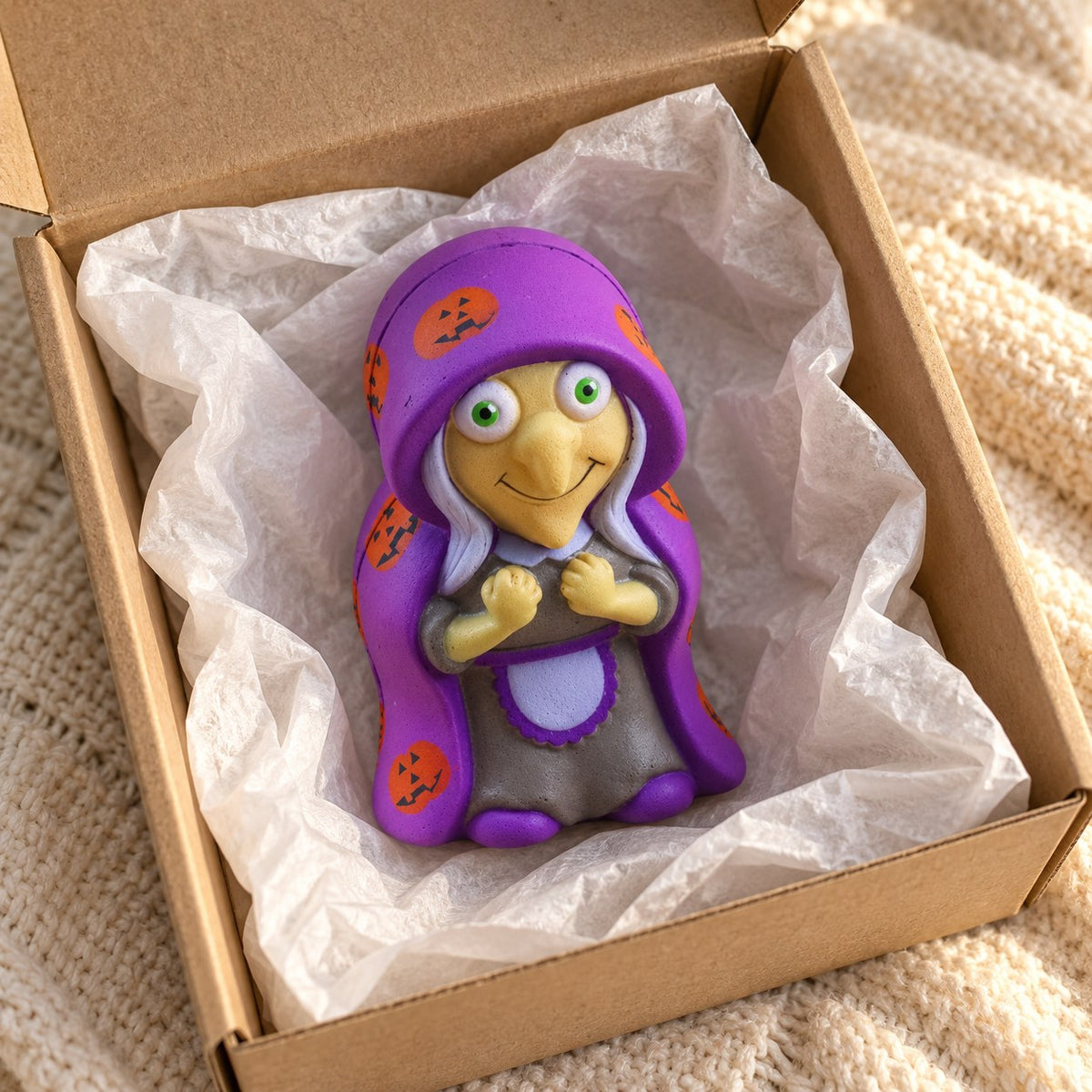 Witch squishy for halloween, unboxed from a parcel with tissue paper
