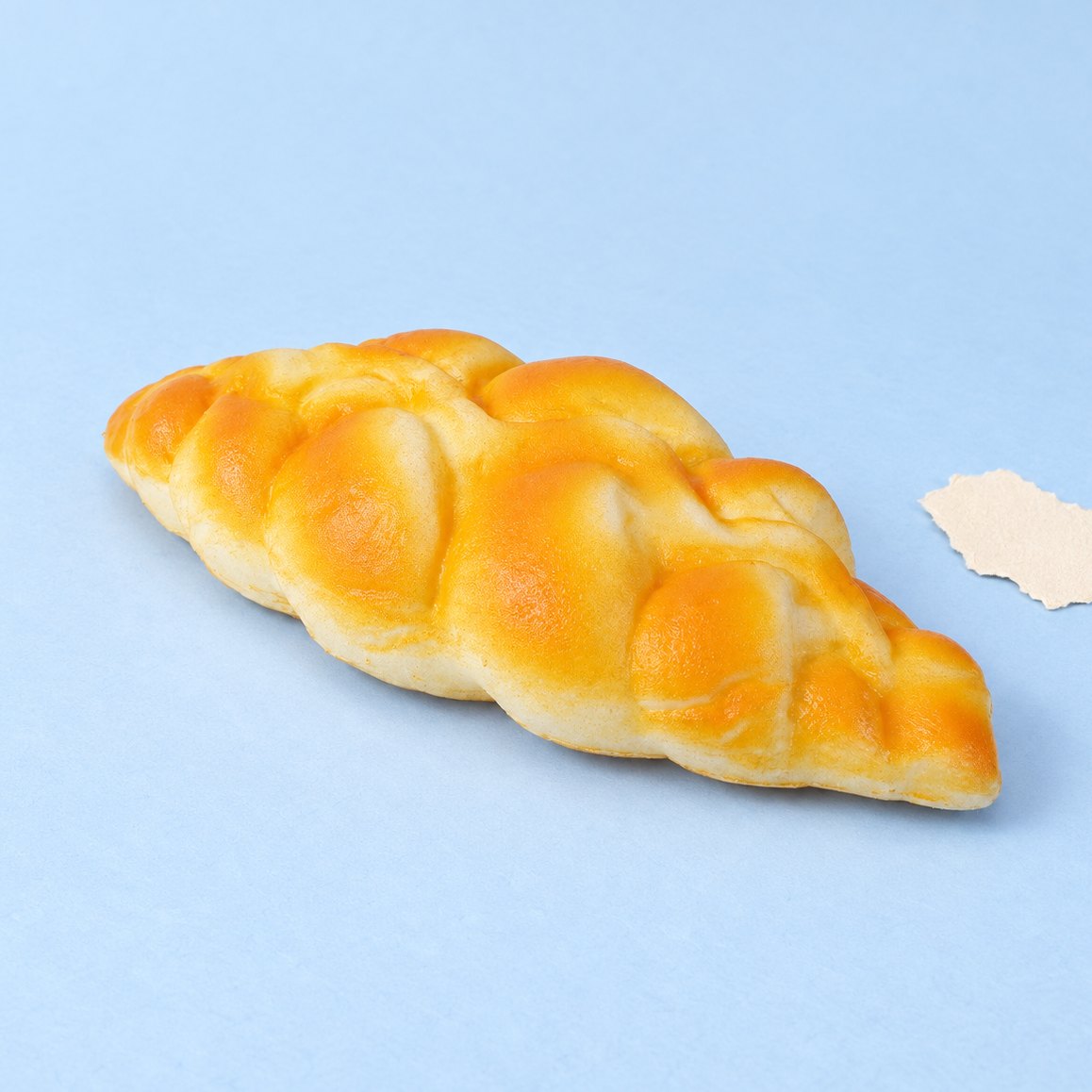 Zopfbrot Squishy, geflochtenes Brot mit 19 cm, auf Pastellpapier